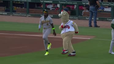 Lawrence Butler and Blooper warm up before the game