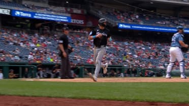 Kyle Stowers comes in to score on an error