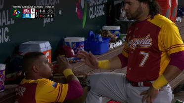 Escobar plays drums in the dugout