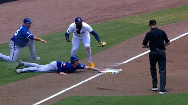 Junior Caminero applies the tag after review