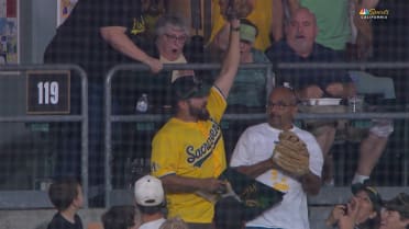A's fan makes a nice foul ball catch 