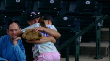Lucky fan in the stands gets a ball!