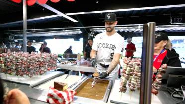 Brenton Doyle serves berry kebabs before game