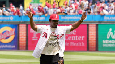 Nakobe Dean throws the ceremonial first pitch