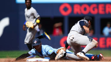 Andrés Giménez safe at second after challenge