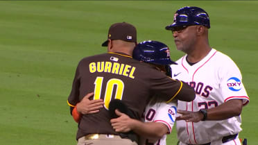 Former teammates Altuve and Gurriel embrace on field