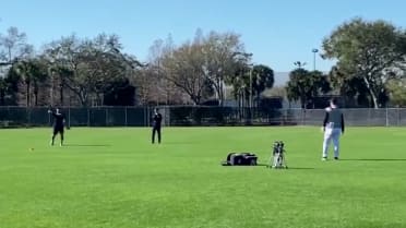 Jasson Domínguez tosses during Spring Training