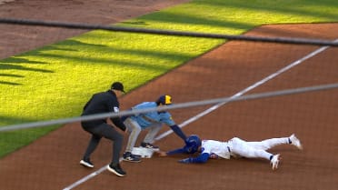 Garrett Mitchell throws out runner after challenge