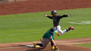 J.P. Crawford nabs Francisco Lindor after a review