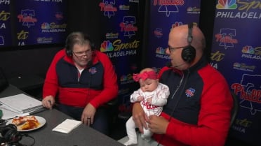 A baby joins the broadcast booth in Philly