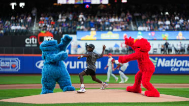 Elmo, Cookie Monster and Silas' first pitch