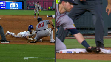 Adam Frazier steals third base after review