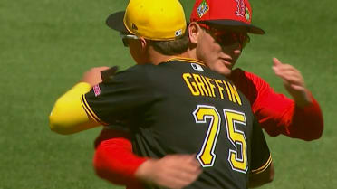 Roman Anthony and Konnor Griffin hug before game