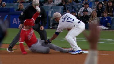 Taylor Ward safe at third base after a review 
