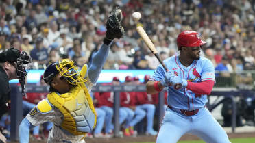 Pedro Pagés scores on a wild pitch