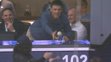 Rays' executive Erik Neander gives foul ball to fan