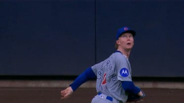 Christian Yelich reaches on an error