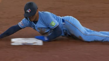 Andrés Giménez steals second base