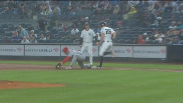 DJ LeMahieu out at first base stands after challenge