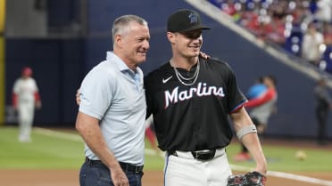 Jeff and Griffin Conine throw out the first pitch