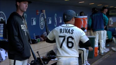 Leo Rivas scores on a wild pitch