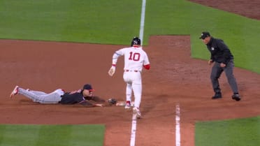 Travis Bazzana dives to first base bag to record out