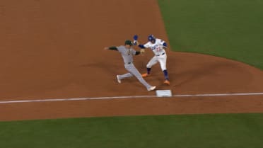Miguel Rojas is out at third after review