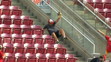 Fan lays out for home run catch