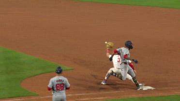 Eddie Rosario is ruled safe at first after review