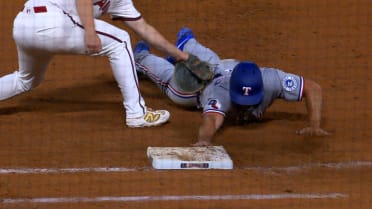 Wyatt Langford safe at first after review