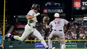 Cole Carrigg is safe at first after review