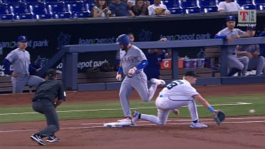 Jake Burger is safe at first, call overturned