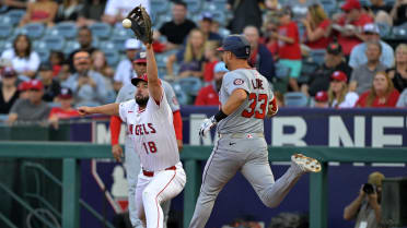 Nathaniel Lowe is safe at first after review