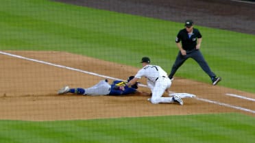 Sal Frelick out at first base on pickoff review