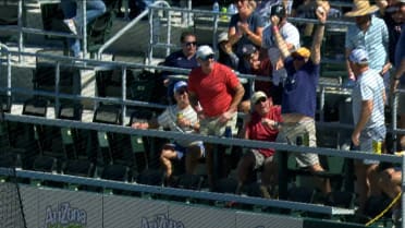Fans loses his drink after a scorching foul ball