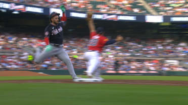 Dylan Crews is called safe at first after challenge