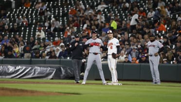 Nolan Jones gets hit by errant throw