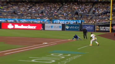 Michael Busch slides, tosses to first base