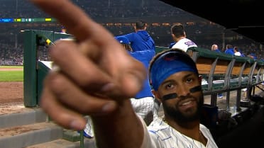 Willi Castro gives young fan bat during game