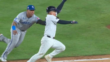 Salvador Perez turns a double play after a review 