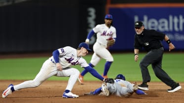 Luis Torrens catches Bobby Witt Jr. after review