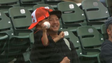 Jung Hoo Lee gives a ball to a fan