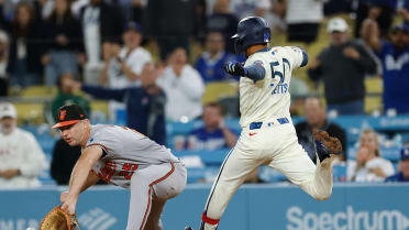 Mookie Betts reaches first safely after a review