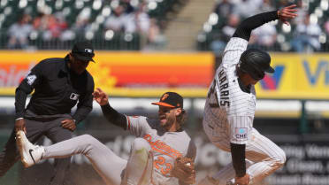 Dustin Harris steals second after review