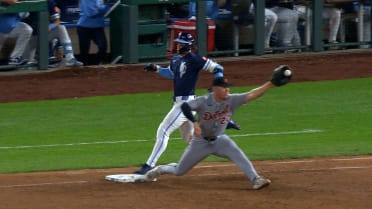 Bobby Witt Jr. safe at first base after a review 