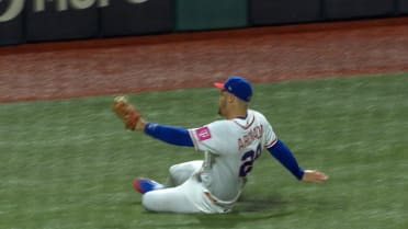 Nolan Arenado slides to make the great catch