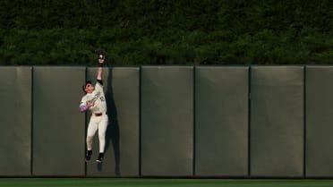 Harrison Bader climbs the wall to steal a hit