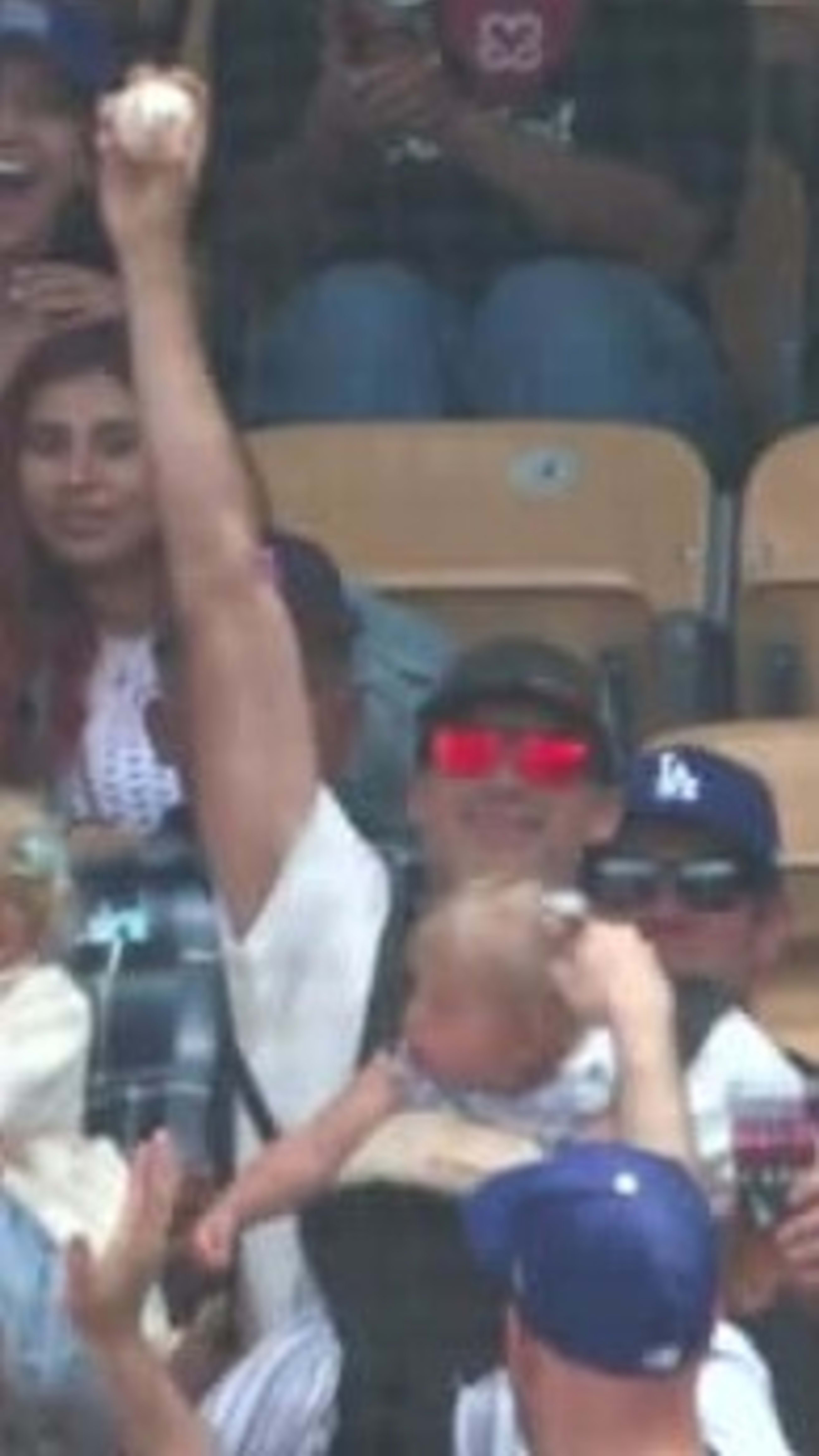 Phillies fan expertly catches home run ball while holding his baby