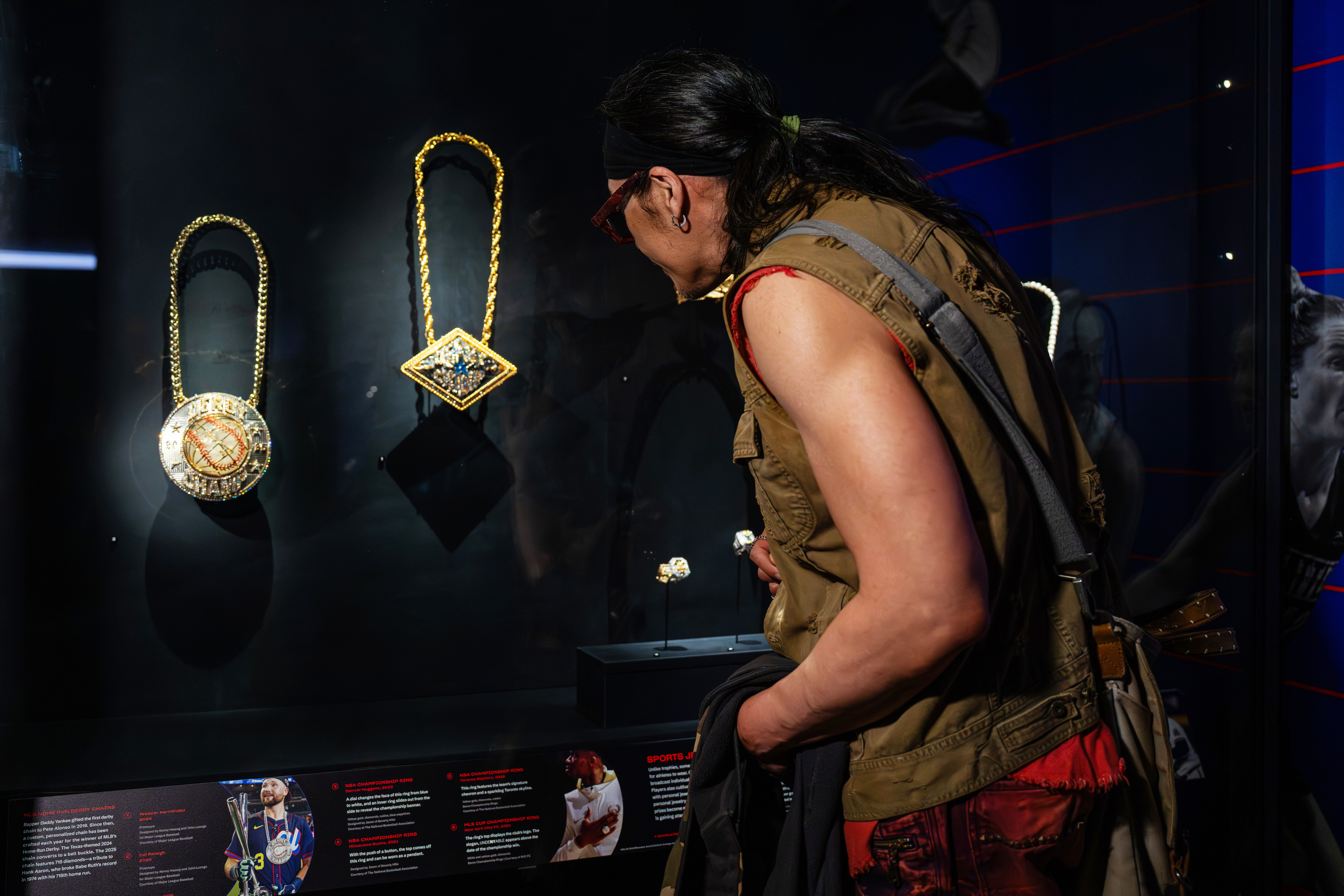Home Run Derby chain designer Kenny Hwang looks at his designs featured in "For the Win: Objects of Sports Excellence."