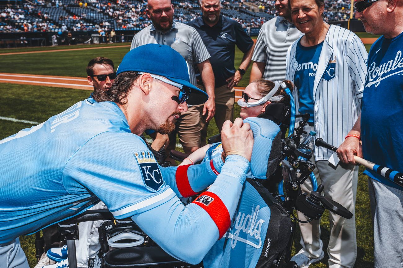 Bobby Witt Jr. signing Sarah Nauser's wheelchair gifted by the Royals